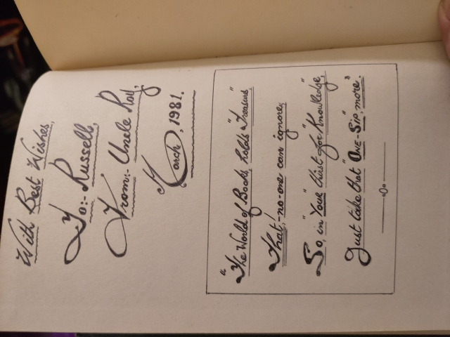 A hand-written note in a book. It reads:
With best wishes
To Russell
From Uncle Roy
March 1981

The world of books holds wonders
That no-one can ignore
So in your thirst for knowledge
Just take that one sip more