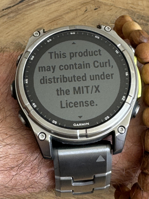 A silver Garmin watch displaying that it might contains Curl. 