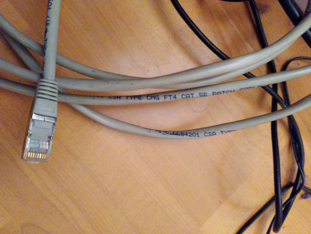 CAT5e cable.
The clicky thing that will hold the plug in the socket went the way of all earthly things yonks ago, but it still works