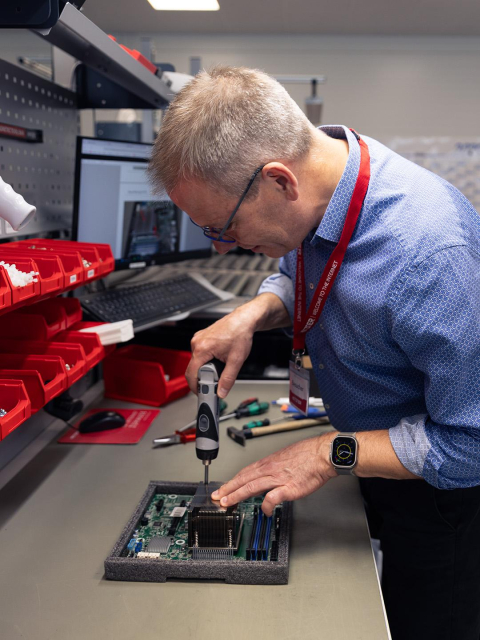 This picture shows the winner getting hands-on experience with a server. 