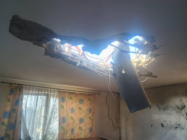A hole in the reinforced concrete roof of a living room
