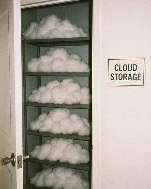 A door with a closet behind it that has fluffy looking clouds on racks.
Next to the door is a sign that says "CLOUD STORAGE"