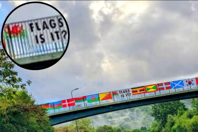Brilliant response to the spate of English flag flying across the UK, seen in Blackwood, Wales. Flags from dozens of different countries strung across a bridge, with a banner in the middle reading "Flags, is it?"