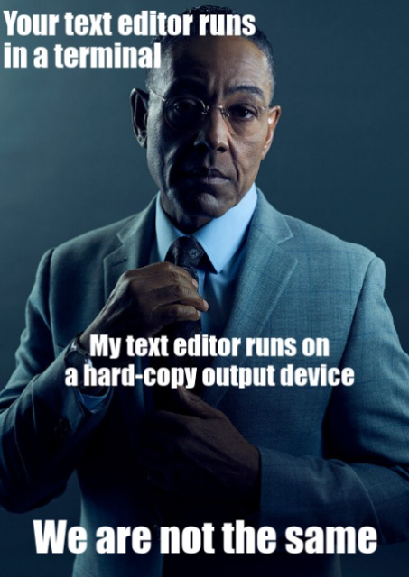 Giancarlo Esposito dressed in a suit and adjusting his tie while giving a condescending look. "Your text editor runs in a terminal. My text editor runs on a hard-copy output device. We are not the same."