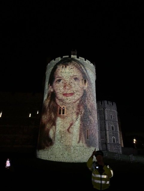 An image of Virginia Giuffre being projected on the Windsor castle.