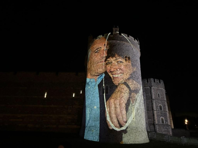 A picture of Jeffrey and Ghislaine being projected on the Windsor castle.