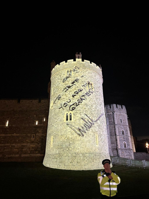 A handwritten message of Trump: "To Jeff, you're the greatest" being projected on the Windsor castle.