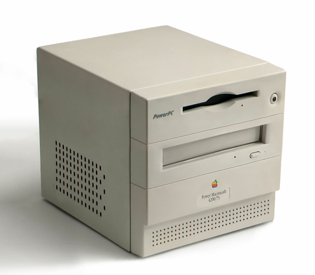A photo of a small weird cube shaped beige mac with wacky design. It's badged as a Power Macintosh 4200/75, and its front is divided into three sections; a logo/badge area, a cdrom above that, and a floppy drive above that. It looks singularly unexciting, but of the era and is against a white background like the most white-background of promo shots.