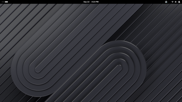 Screenshot of the same desktop in a dark style, with the Slack icon next to the system icons.