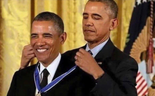 Obama in the background giving a medal to himself in the foreground.