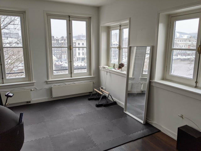 photo of the room with a mirror leaning against the wall