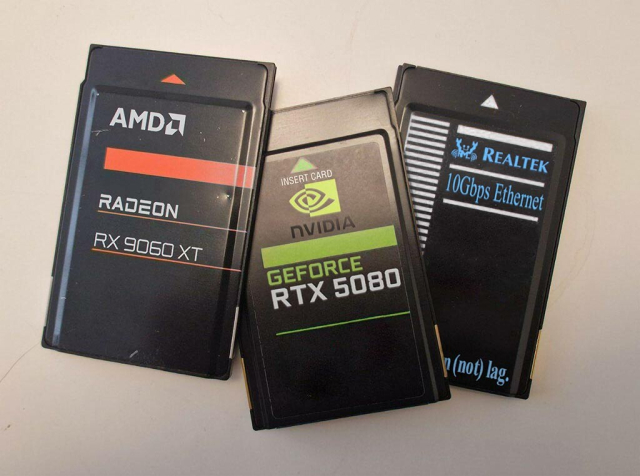 A group of three PC cards, one an AMD Radeon EX9060XT, the middle an Nvidia GeForce RTS5080 and the last a Realtek 10Gbps Ethernet card so you can not lag.