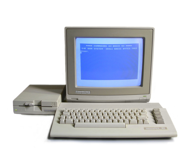 Photo of a Commodore 64C, 1802 monitor, and 1541-II floppy drive.