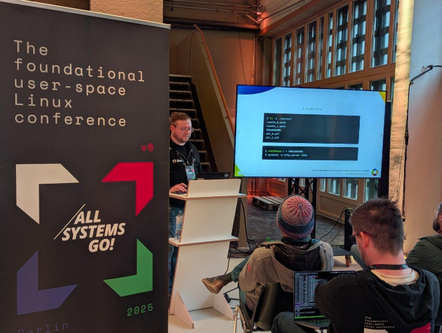 Emmanuele Bassi talking about "Yocto's hidden gem: OTA and seamless updates with systemd-sysupdate" at All Systems Go! 2025