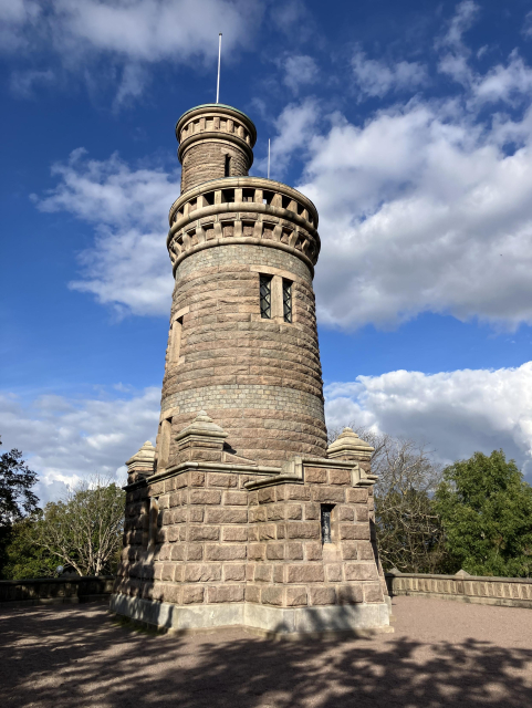 View of tower from about 1900, with blue sky behind.
