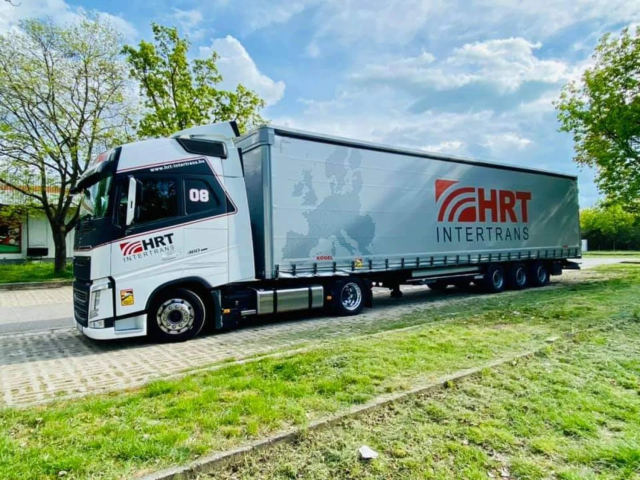 a truck with a logo saying "hrt intertrans"