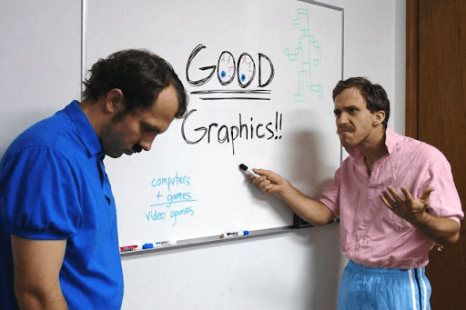Photo of two 80s-looking men at a whiteboard. The man with the marker looks angry, and has written “GOOD Graphics!!” with “GOOD” underlined twice. The other man, presumably the one who was meant to create the graphics, looks dejected.