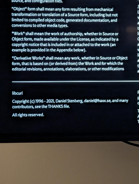 Fine print including libcurl's copyright, reading:

"Libcurl

Copyright 1996 - 2021, Daniel Stenberg, daniel@haxx.se, and many contributors, see the THANKS file.

All rights rest."