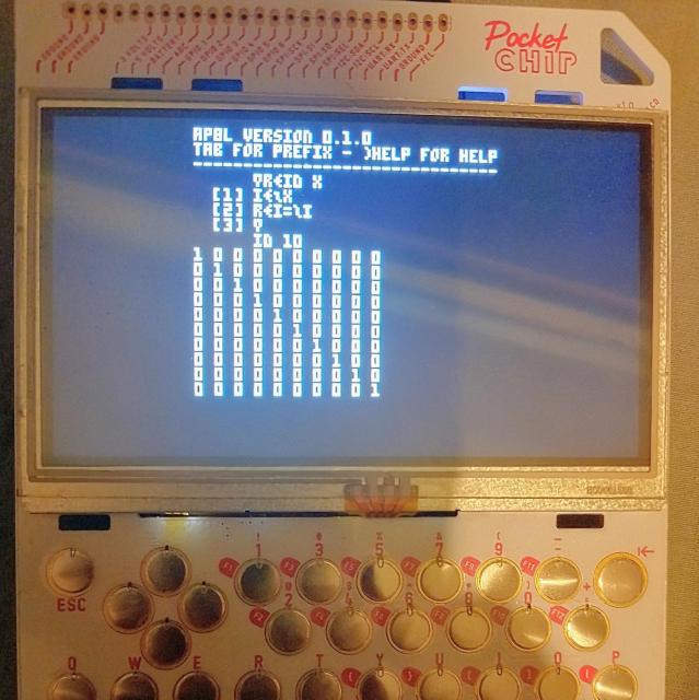 A photo of the Pocket CHIP portable computer running AP8L inside Pico-8. First, a function creating an identity matrix is defined; next, it is ran with argument 10, creating a 10x10 identity matrix.