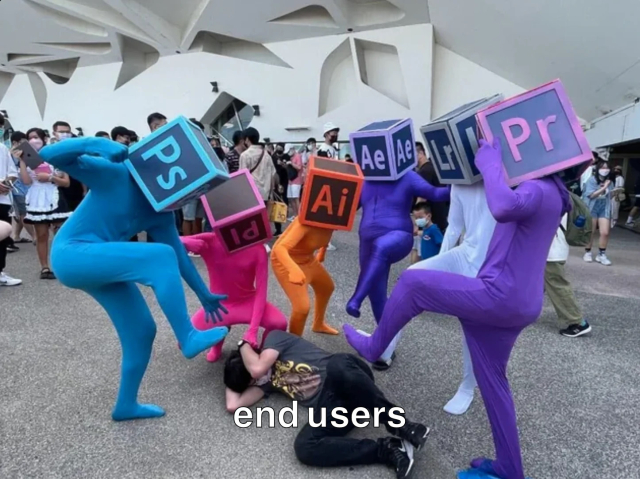 A group in multicoloured Adobe Suite themed lycra suits (wearing square head mask for the icons for: Photoshop, Prelude, Illustrator, After Effects, Lightroom, & Premiere Pro.) collectively beating on a person bracing on the ground (Captioned End User).

Original uncaptioned photo via: u/_Cybernaut_ 