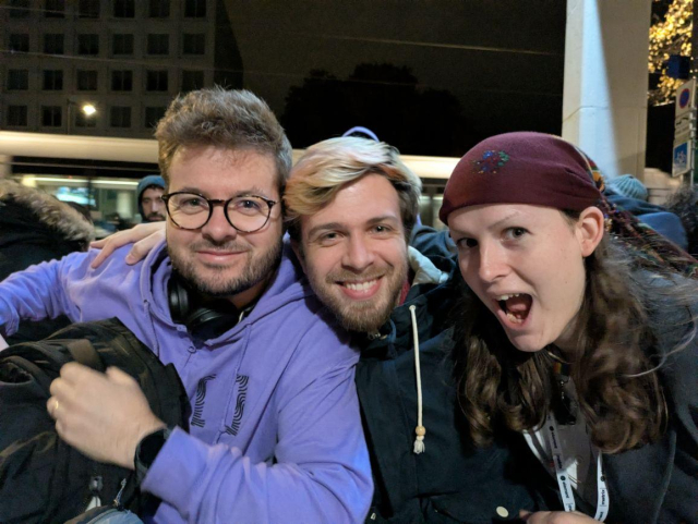 A picture with three people smiling together. On the left is Thib, in the middle is Kim, and on the right is Braid