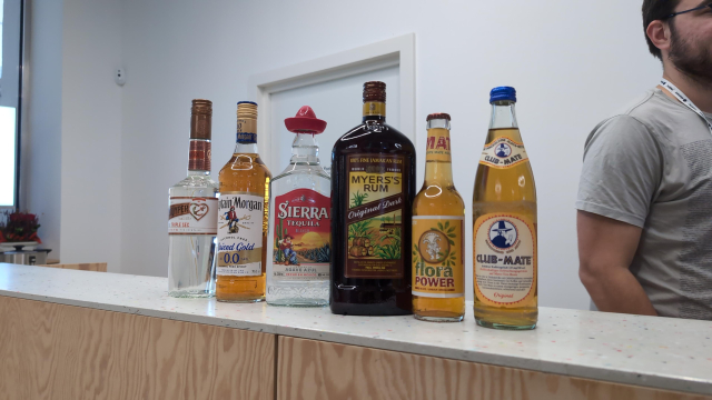 A variety of liqueurs and mate on a bar.