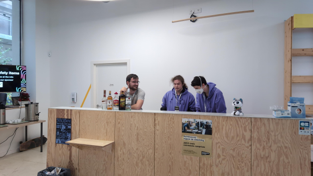 Volunteers preparing the bar for cocktails.