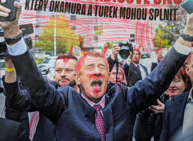The Czech populist politician Andrej Babiš with drawn red horns which make him look like a devil.