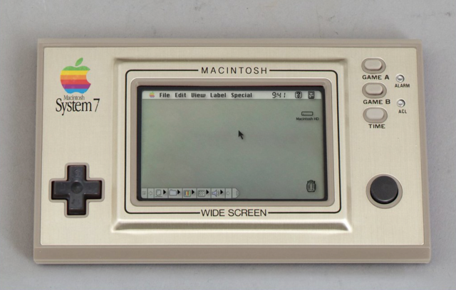 A picture of a small LCD hand-held game device probably from the early 80s in some dimension or another. It's a silvery beige brushed metal device with a d-pad, button, GAME A, GAME B and TIME buttons, and a little Apple logo and Macintosh System 7 logotype below it. Onscreen is a little fixed greyscale LCD with colour background display that doesn't have any really obvious way of doing anything whatsoever.