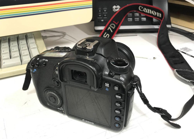 A photo of a left-handed Canon 7DL dSLR, with the controls and grip on the left and rear screen on the right.