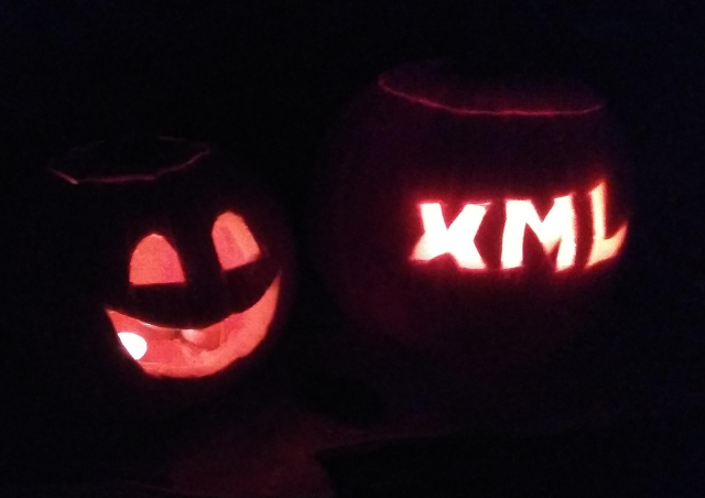 Two pumpkins at night - a happy face, and another with the letters X, M, ,L. Because XML makes me happy.