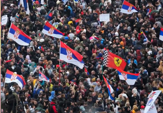 Aerial image of large crowds with flags