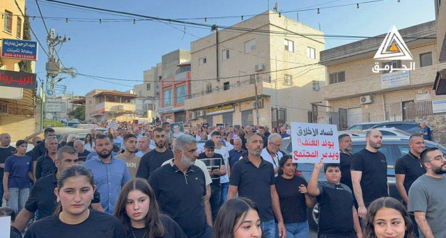Protesters marching through the streets with placards decrying increased police violence