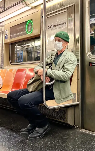 Tom Hanks on the NYC subway in a surgical mask. 