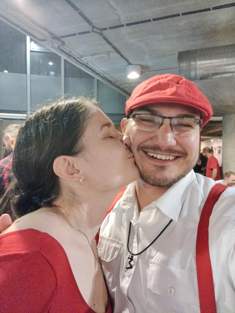 Me and anna happy on a swing session. Both of us are wearing red accented swing clothes.