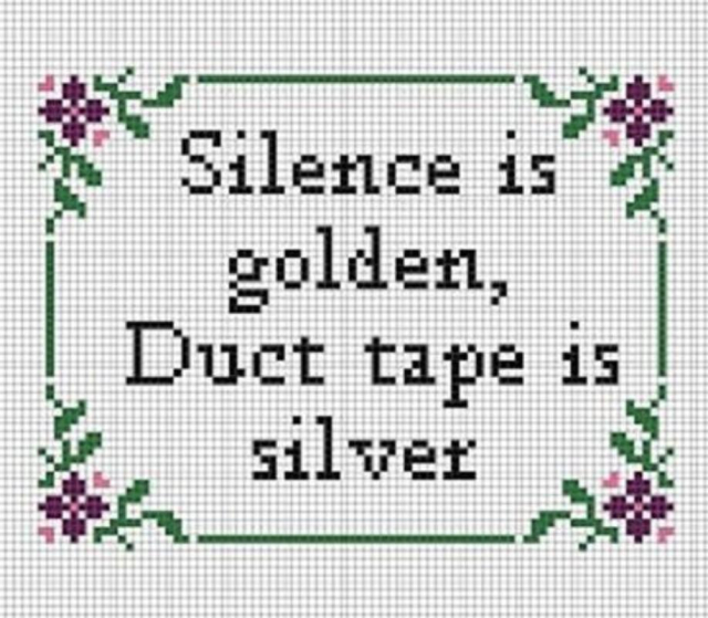 Embroidered panel, white with green border and purple flowers in each corner. In the centre is black writing that reads "Silence is golden, Duct tape is silver."