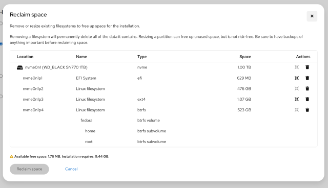 Dialog titled "Reclaim space" showing a disk partition table for nvme0n1 (WD_BLACK SN770 1TB) with four partitions (EFI, Linux filesystems including ext4 and btrfs), sizes listed and actions icons, and a footer warning that available free space is 1.76 MB while installation requires 9.44 GB.