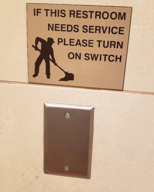 Photo of a bathroom sign that has an outline of someone mopping and says, "If this restroom needs service, please turn on switch."

The switch, however, has been removed and replaced by a metal cover. No clicky for you!