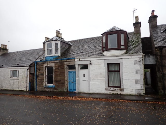 Apair of single storey stone houses on Ogilvy Street, Tayport. The attic windows are typical of Scottish vernacular architecture up to WW2.