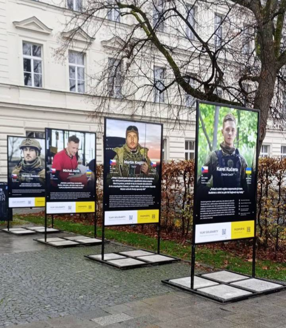 A wider angle of the banners standing on a street