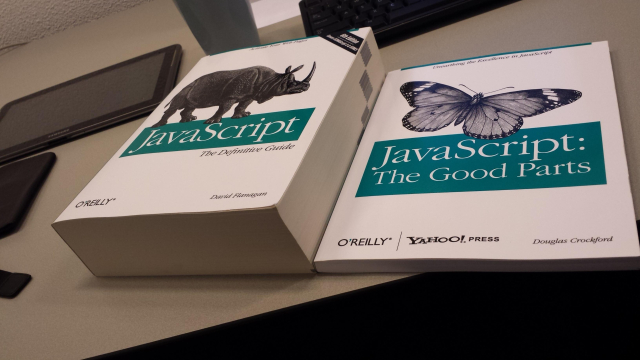 thick o’reilly book called “javascript” next to thin o’reilly book called “javascript: the good parts”