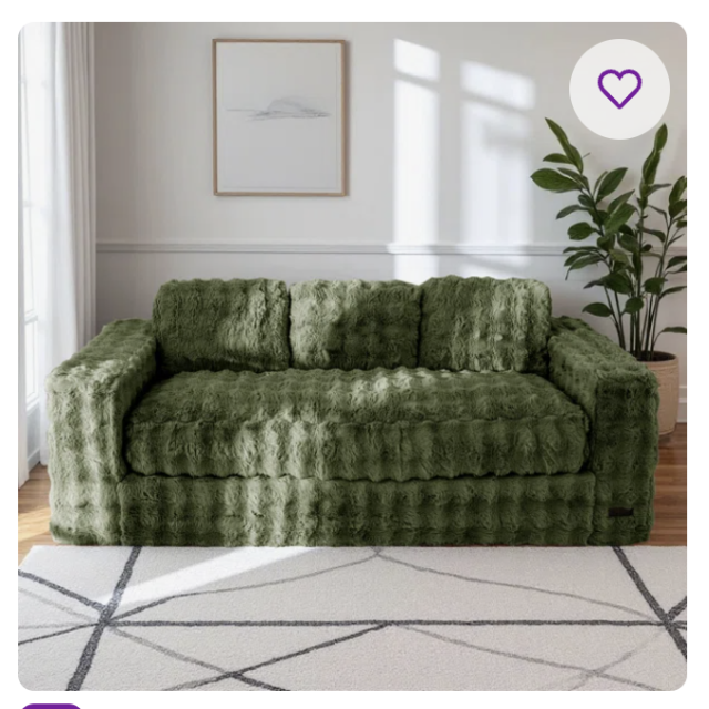 A sofa covered in moss green fluffy fabric