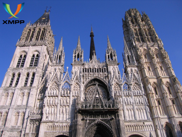 PIcture of the frontside of the cathedral Notre Dame de Rouen with a XMPP logo at the upper left corner
