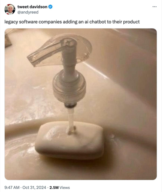 A tweet from @andyreed: “legacy software companies adding an ai chatbot to their product .”The image is a broken soap dispenser pump sitting in a puddle of soap on a bathroom sink, used as a humorous metaphor for legacy software companies hastily adding AI features to their products.