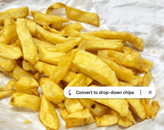 A portion of potato chips (or ‘fries’ in American) lying on a sheet of grease-proof paper, with a Google Sheets LLM prompt overlaid, saying “Convert to drop-down chips”.