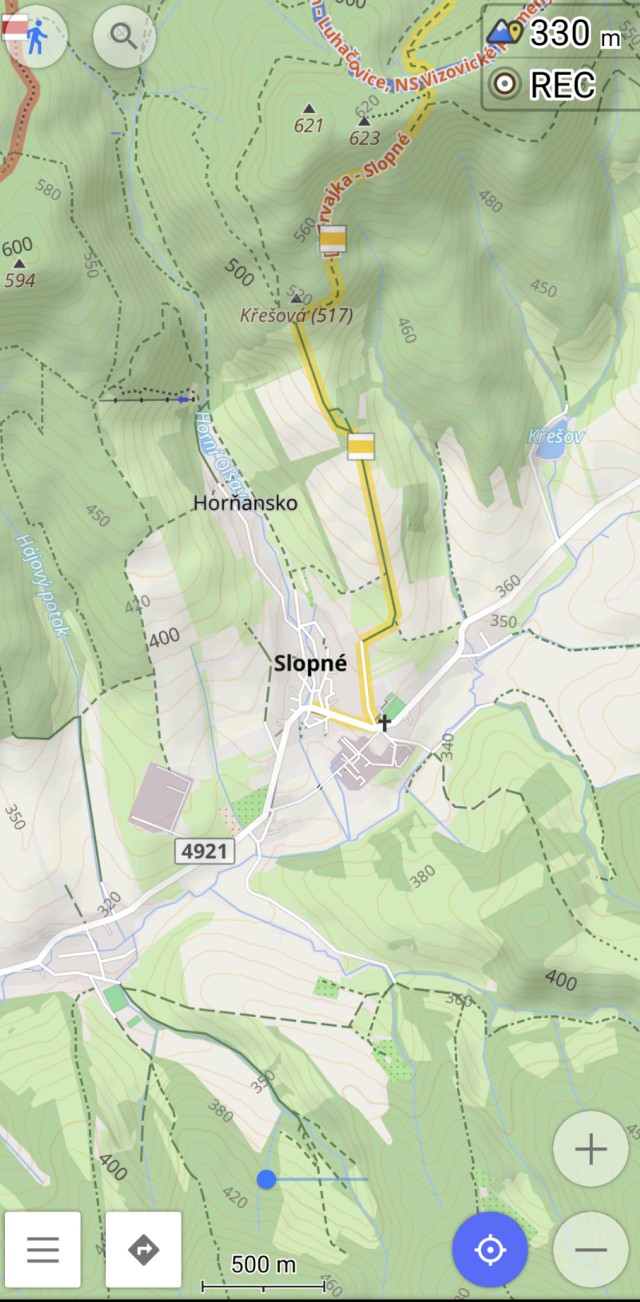 A map in OsmAnd showing the village of Slopné. Forests are differentiated in different colors of green.