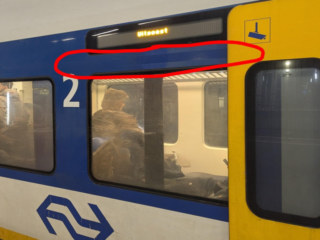 An outside view of a SLT train, showing is large number 2 but also traces of removed white horizontal line above the windows of the former 1st class compartment.