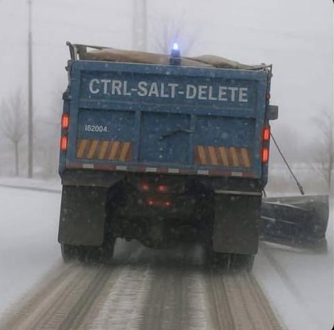 The back of a snow truck emblazoned with the term: CTRL-SALT-DELETE