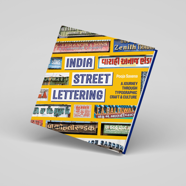 A mockup of the India Street Lettering book. The book is standing on its bottom right corner on a grey background. Its front cover with snippets of various signs in centrestage.
