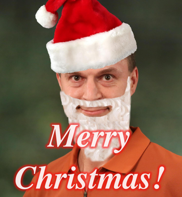 Photo of Daniel with added photoshopped santa hat and beard with the text "Merry Christmas"